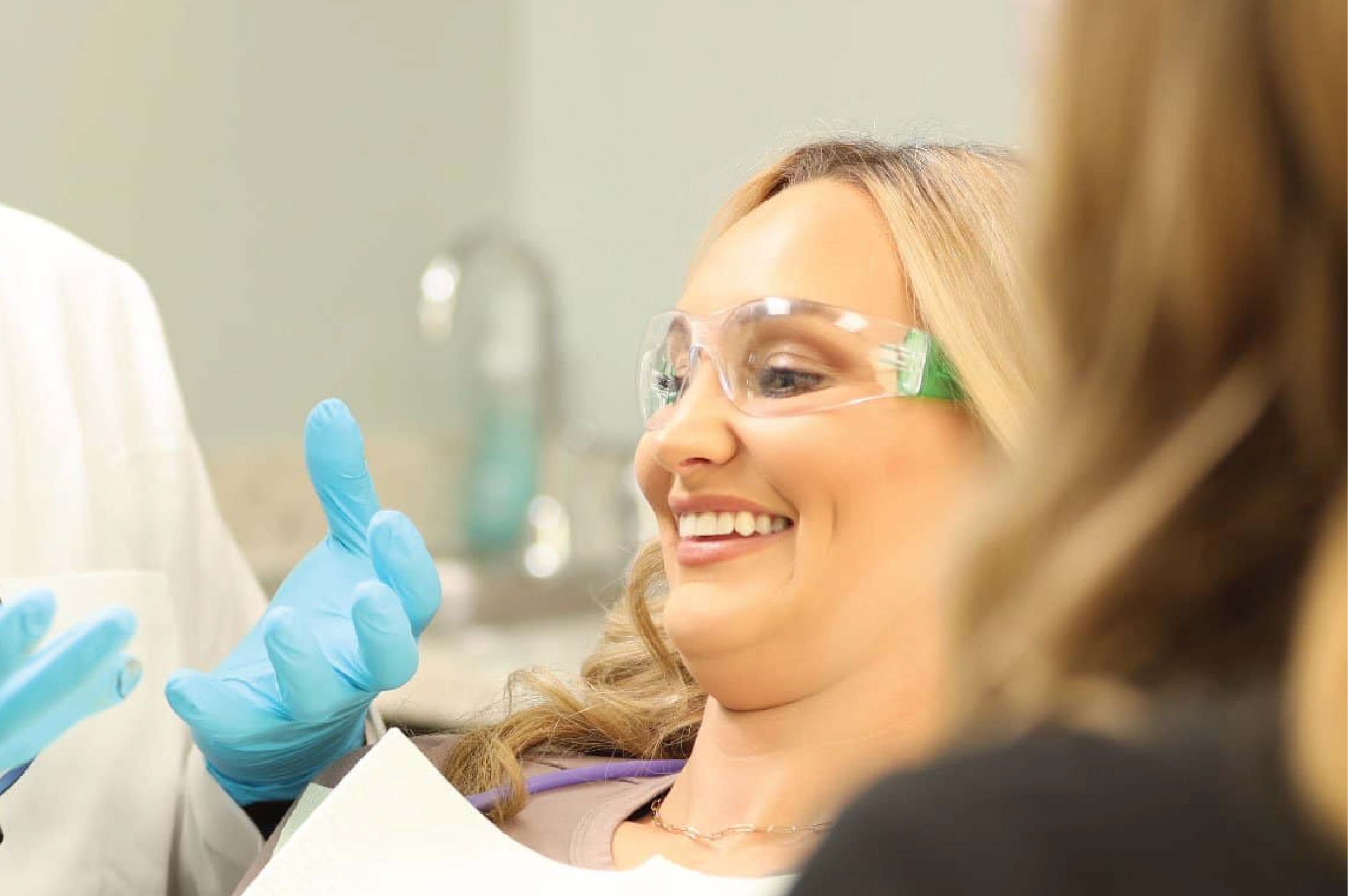 Beautiful girl is showing her white teeth